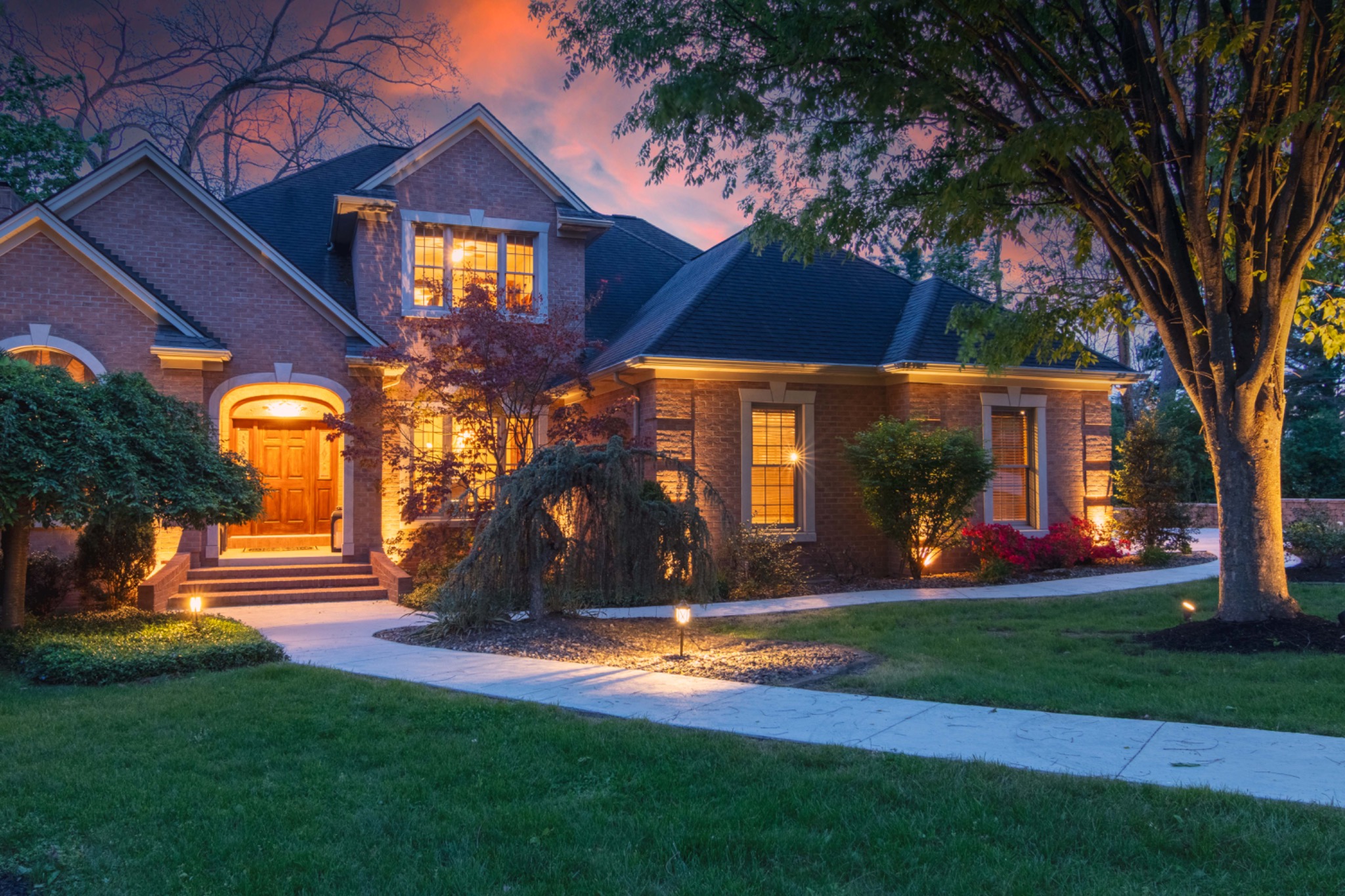Twilight exterior of a warmly lit home